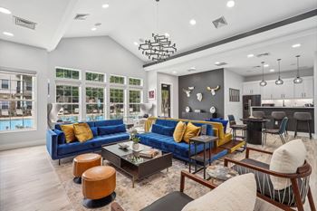 resident clubhouse with seating and kitchen